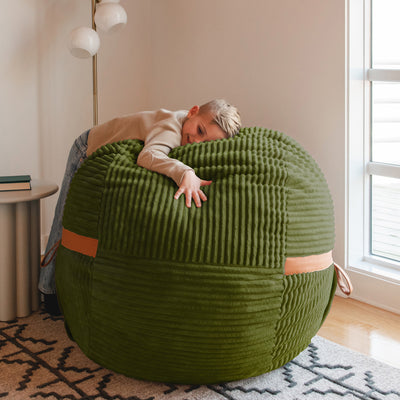 Boy hugging fuf medium in moss green 
