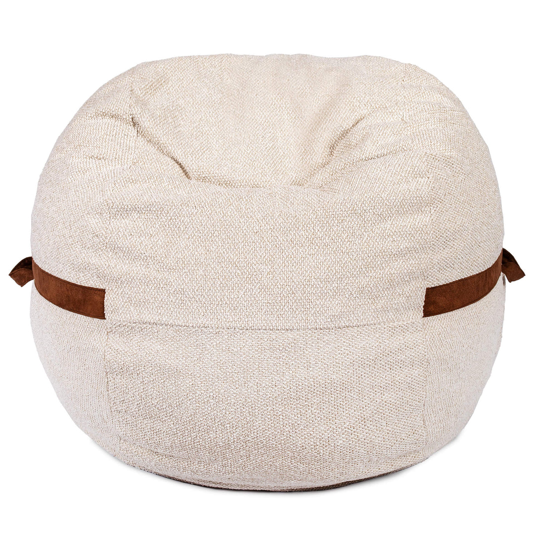 Beige bean bag chair with brown straps on a white background #color_sandstone-textured-boucle