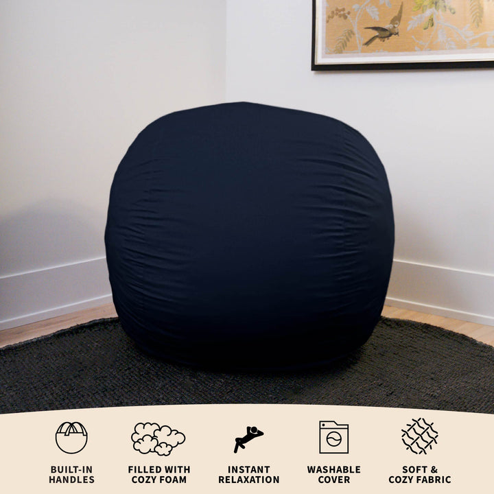 Black bean bag chair in a room with a framed picture on the wall. #color_cobalt-brushed-denim