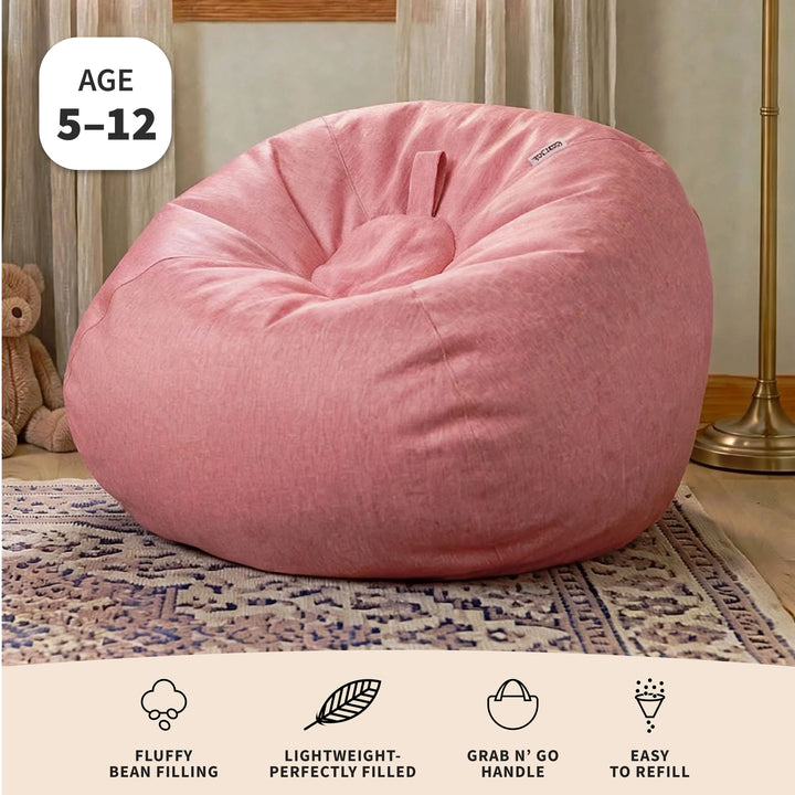 A large pink bean bag chair in a styled room setting with a rug, floor lamp, and teddy bear visible, plus text overlays indicating age 5-12 and product features.  