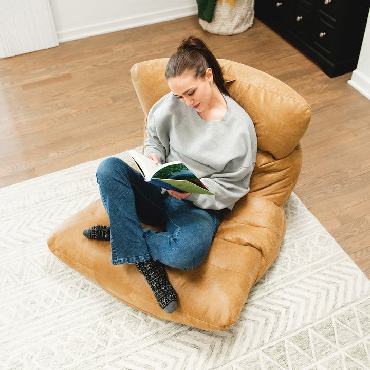 Woman reading on the Roma Bean Bag Chair for adults #color_rustic-tan
