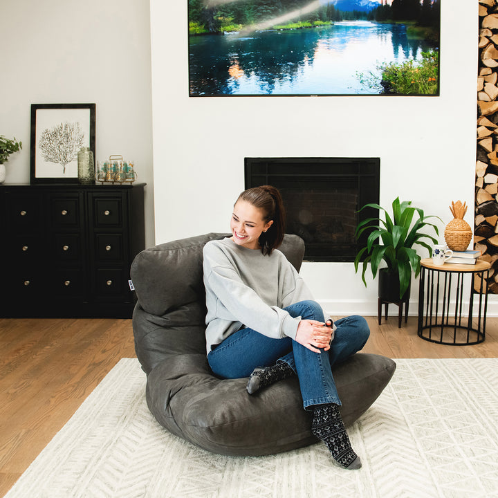 woman relaxing on the Roma Bean Bag Chair in Shadow Graphite Vintage Suede #color_shadow-graphite
