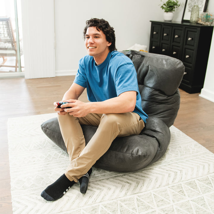 Man playing video games on the Roma Bean Bag Chair in Shadow Graphitel Vintage Suede #color_shadow-graphite