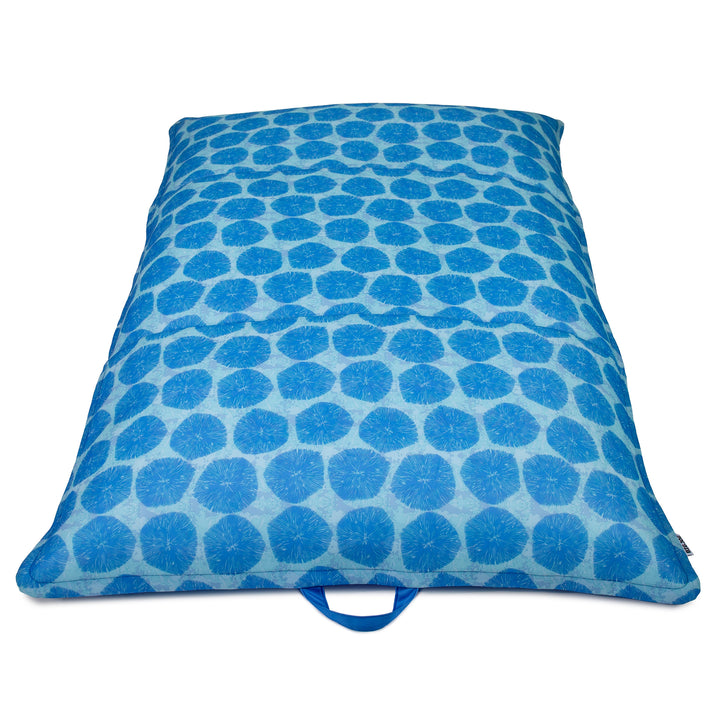 Blue polka dot pool float lounger on a white background #color_coral-bloom