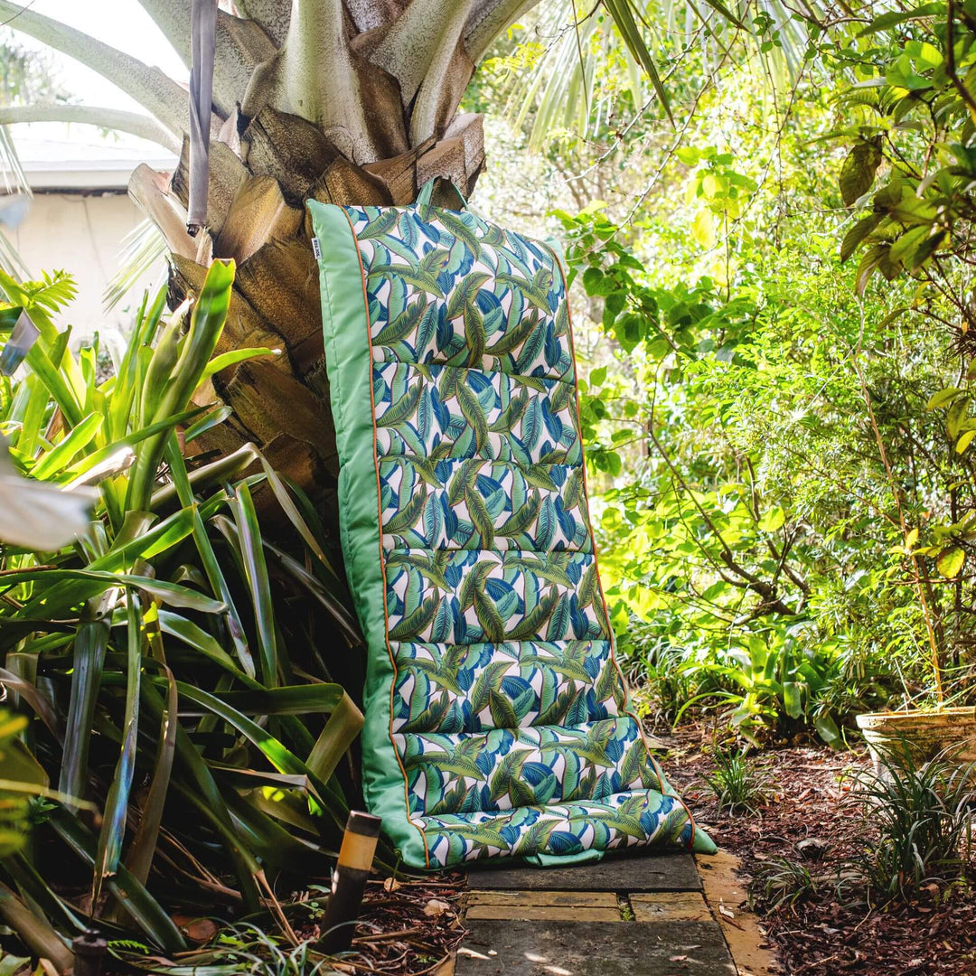 Kona Pool Lounger hanging to dry #color_green-tropical-palm