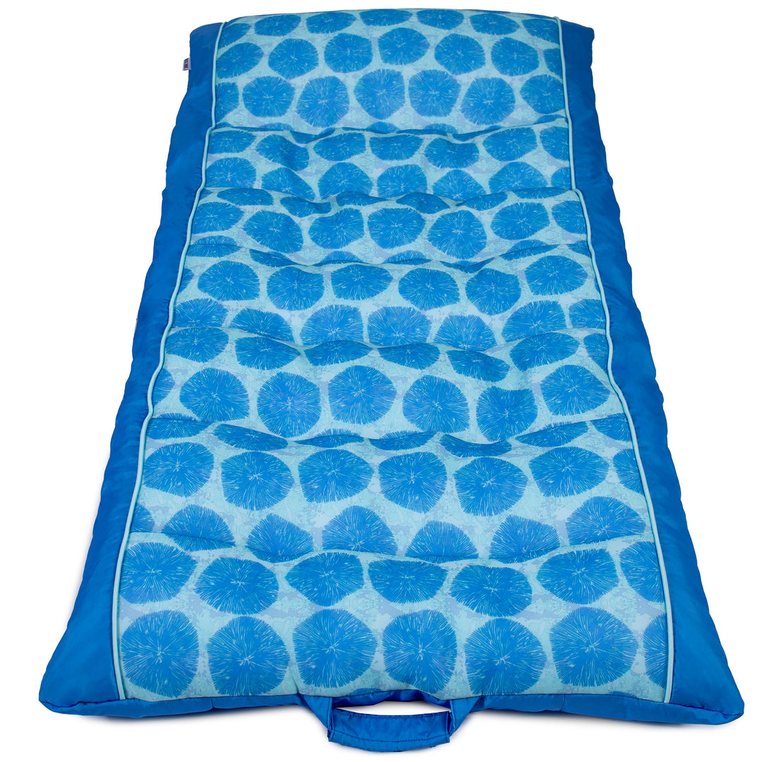 Blue patterned pool float on a white background #color_coral-bloom