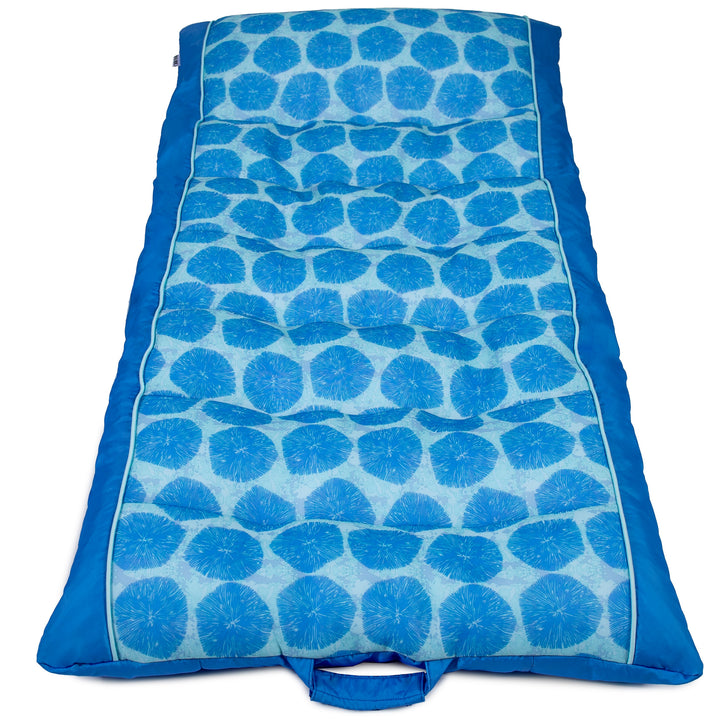 Blue patterned pool float on a white background #color_coral-bloom