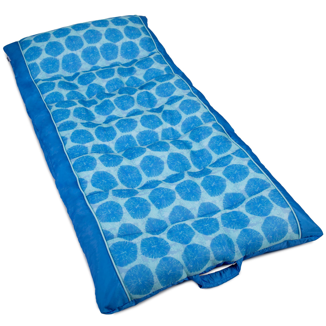 Blue patterned pool float on a white background #color_coral-bloom