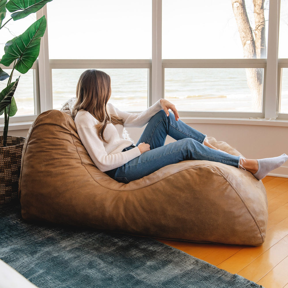 Unwind on the Delmont Chaise Lounger #color_vintage-brown-vegan-suede