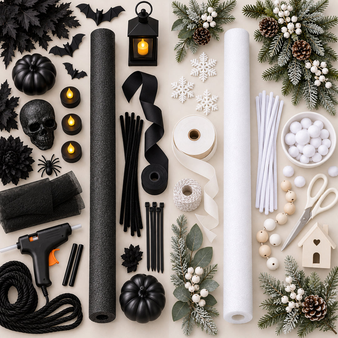 A Halloween craft kit arranged in a flat lay on a light beige background, including black foam rolls, white foam rolls, black ribbons, white twine, black string, black felt, black pom-poms, white pom-poms, a hot glue gun, small black pumpkins, skull decor, bat cutouts, snowflake decorations, evergreen branches with pinecones and white berries, and a wooden house ornament. 