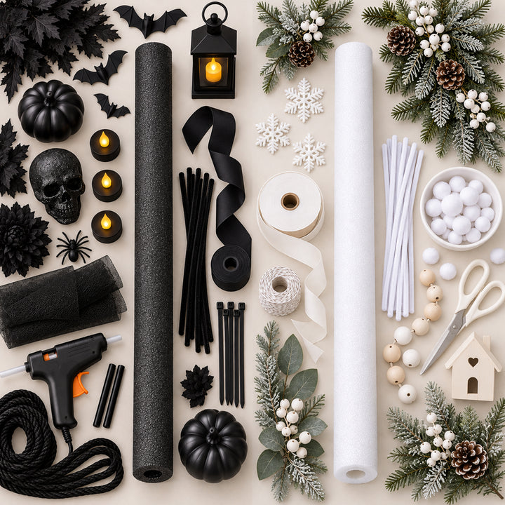 A Halloween craft kit arranged in a flat lay on a light beige background, including black foam rolls, white foam rolls, black ribbons, white twine, black string, black felt, black pom-poms, white pom-poms, a hot glue gun, small black pumpkins, skull decor, bat cutouts, snowflake decorations, evergreen branches with pinecones and white berries, and a wooden house ornament. 