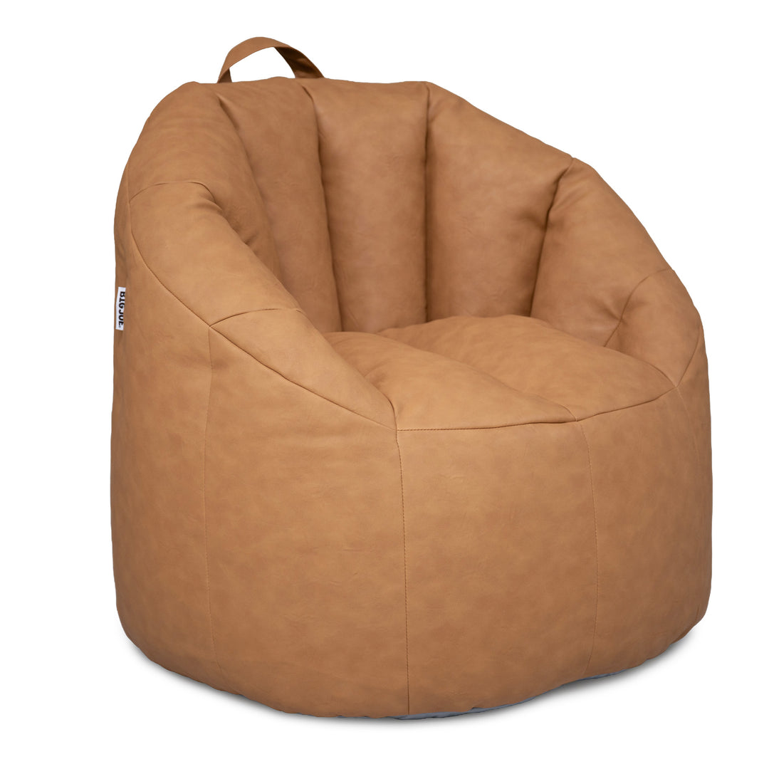 A tan faux-leather bean bag chair with a top carry handle, shown on a solid white background. 