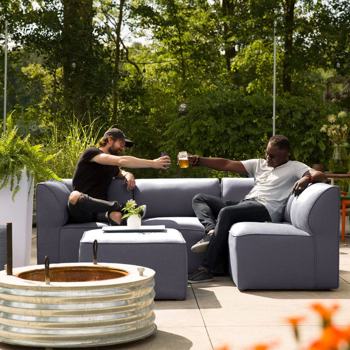 Men relaxing on the patio on a 5pc sectional #color_smoke-gray