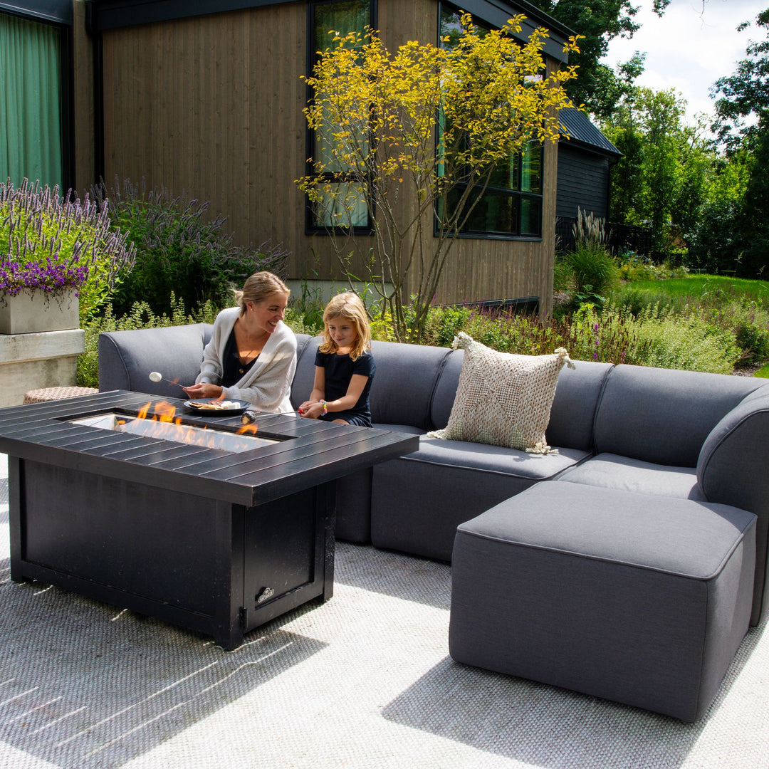 Family relaxing on the patio on a 5pc sectional #color_smoke-gray