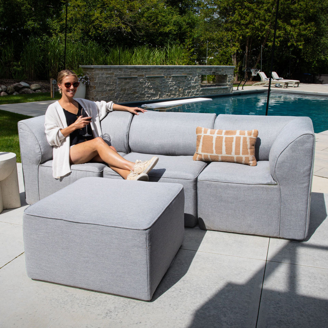Patio Furniture 4pc set woman relaxing by pool #color_fresh-gray
