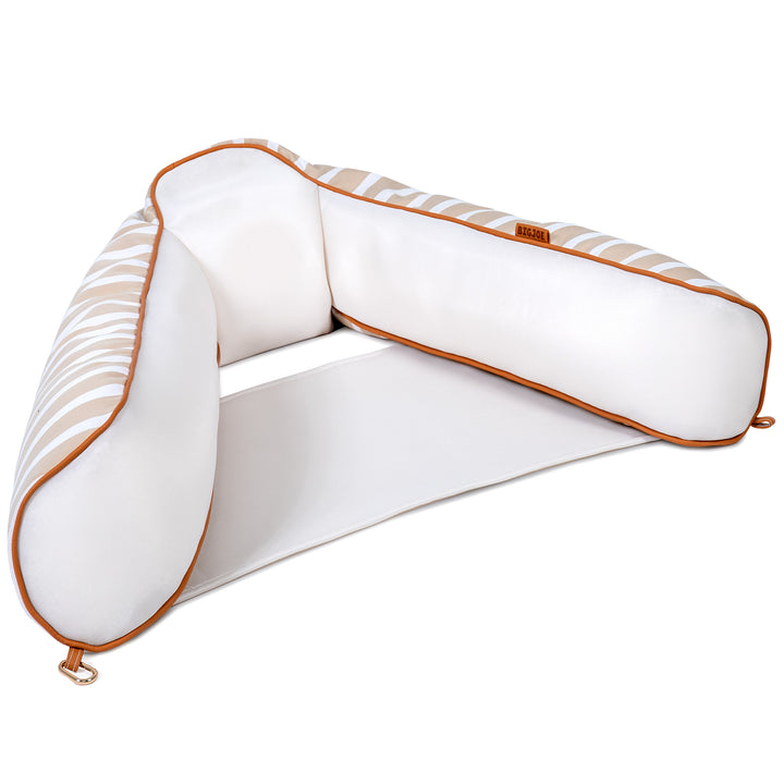 White and gold U-shaped pool float on a white background #color_sand-stripe-sunbrella-fabric