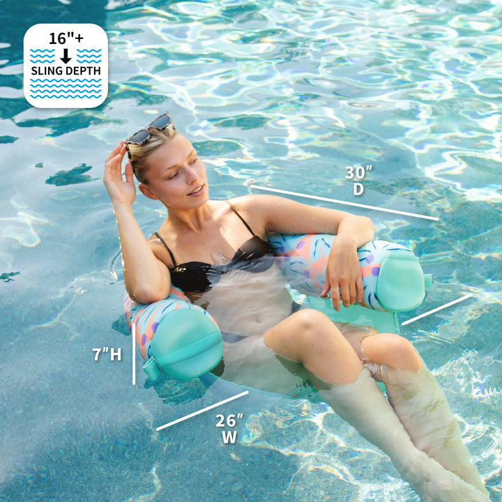 Woman lounging on a pool float with measurements displayed, in a swimming pool. #color_sweet-shells-peach