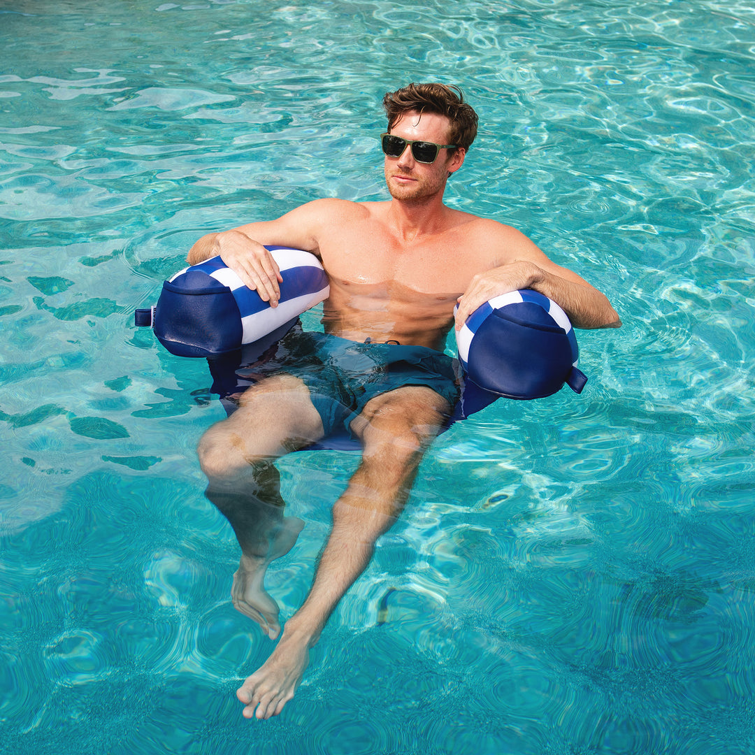 Man relaxing in a pool with noodle sling arm floats #color_americana-nautical-stripe