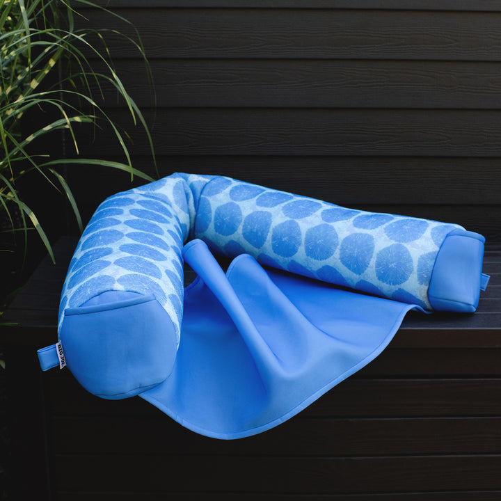 Blue noodle float with patterned cover on a dark wooden surface #color_coral-bloom