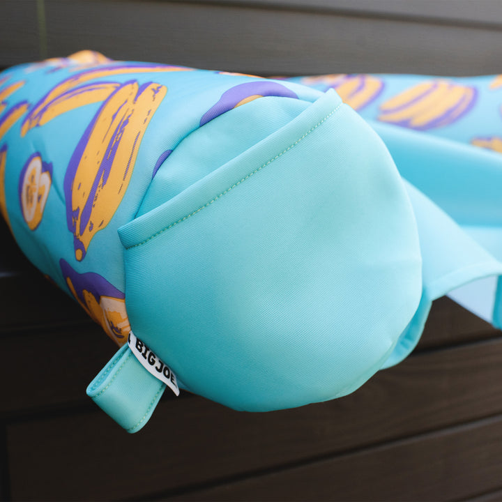 Turquoise inflatable pool float with cartoon character on a wooden  #color_banana-pop