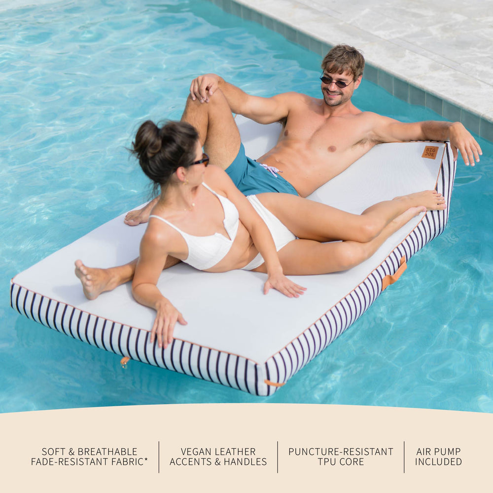 Two people relaxing on a pool float in a swimming pool with product features listed below.