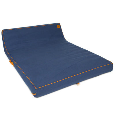 Blue pool float with orange stitching on a white background 