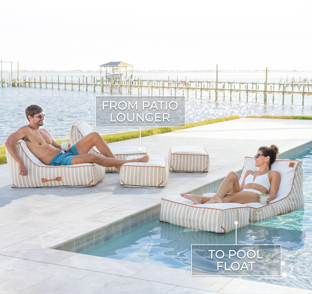 Two people lounging on striped patio chairs by a pool. #color_sand-stripe-sunbrella-fabric