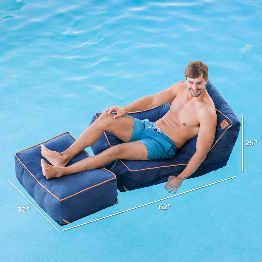 Man sitting on a blue pool lounger with dimensions displayed, against a blue pool background. #color_harbor-blue-sunbrella-fabric