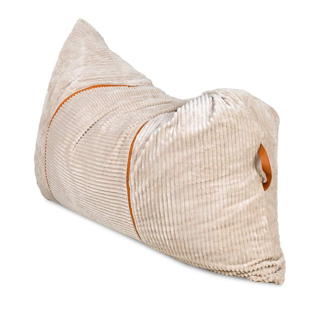 A beige corduroy lumbar pillow with orange contrast stitching and a matching orange accent tab, shown on a plain white background. 