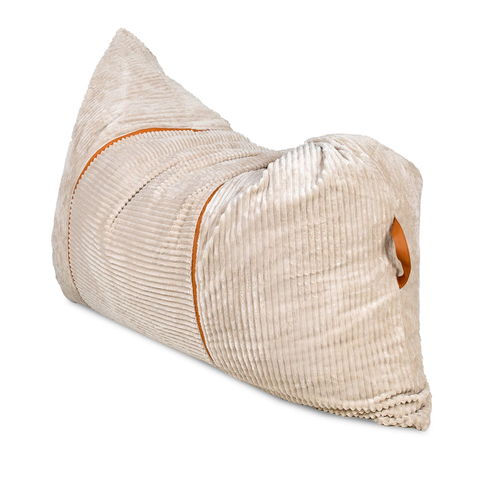 A beige corduroy lumbar pillow with orange contrast stitching and a matching orange accent tab, shown on a plain white background. 
