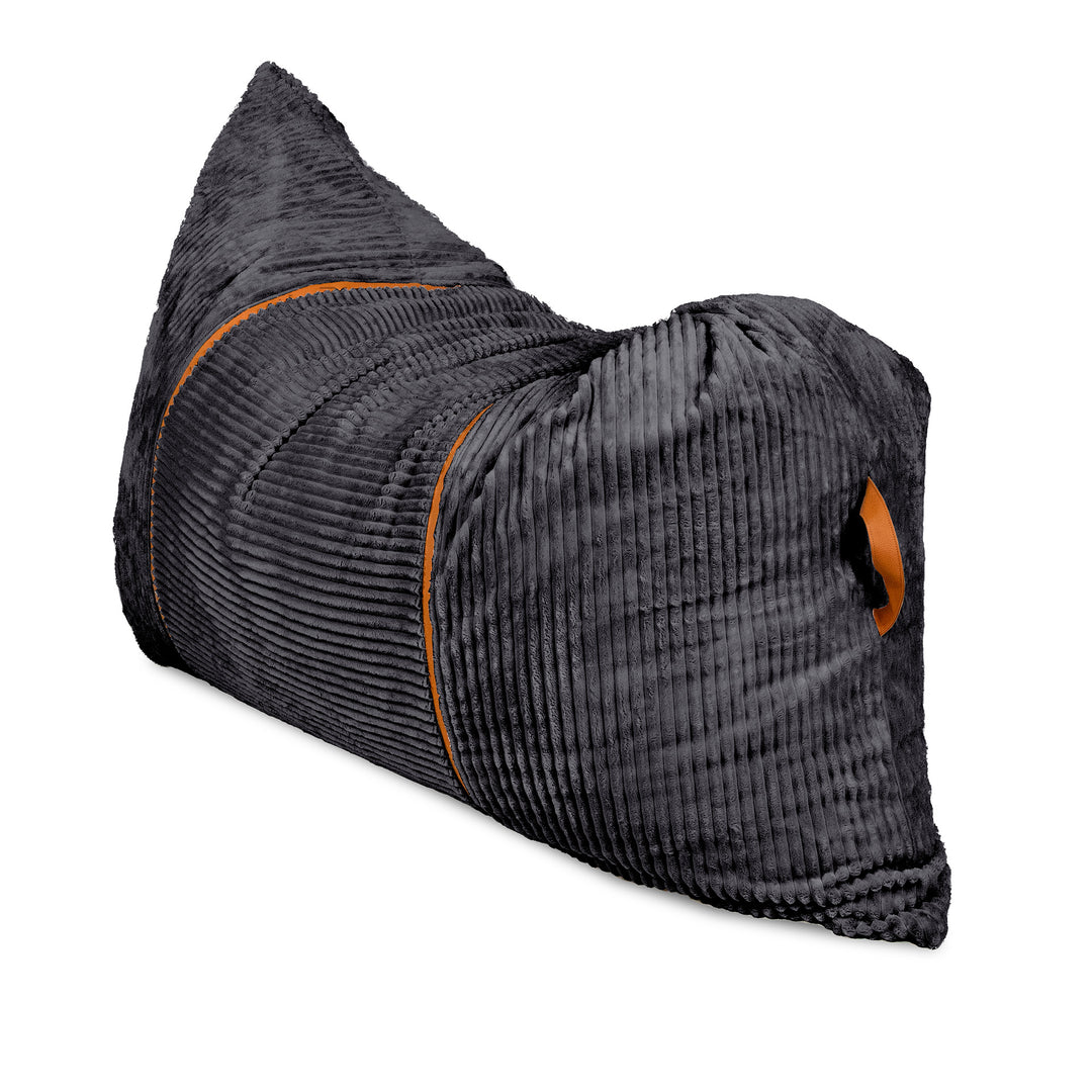 A dark gray ribbed corduroy travel pillow with orange contrast stitching and a small orange logo patch, shown on a plain white background. 