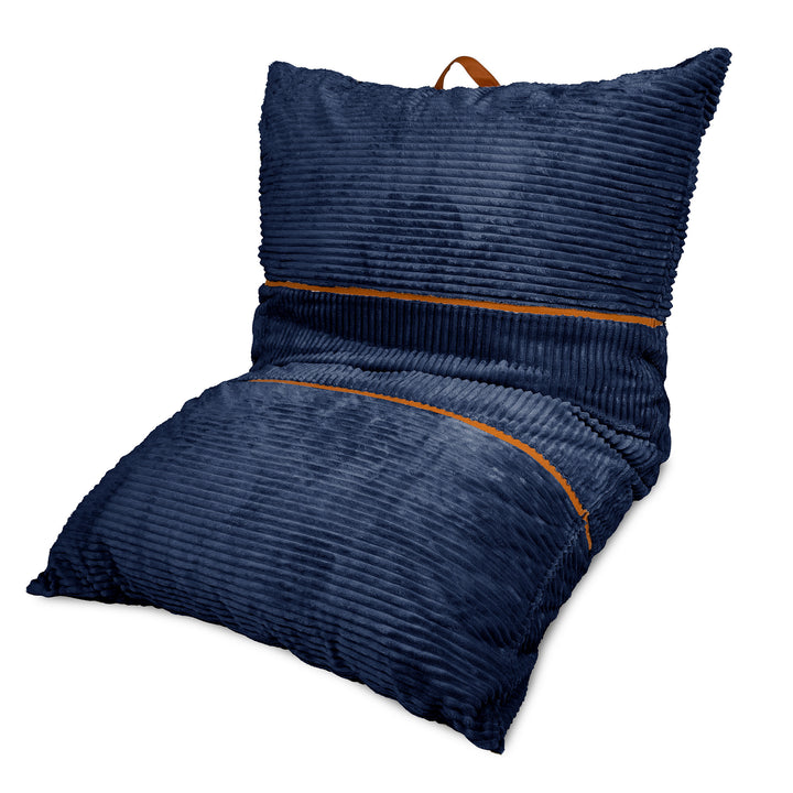 A navy blue corduroy floor cushion with a matching backrest pillow, featuring a brown leather carrying handle on top and thin brown piping accents. 