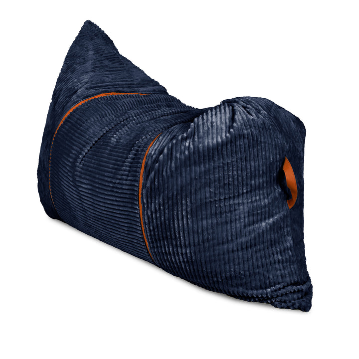 A dark navy blue corduroy lumbar pillow with orange piping and a matching orange accent tab, shown on a plain white background. 