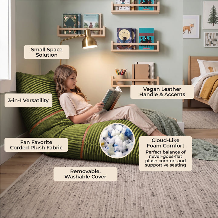 A woman sits on a green corded plush bean bag chair in a styled bedroom setting, surrounded by text callouts highlighting product features like &