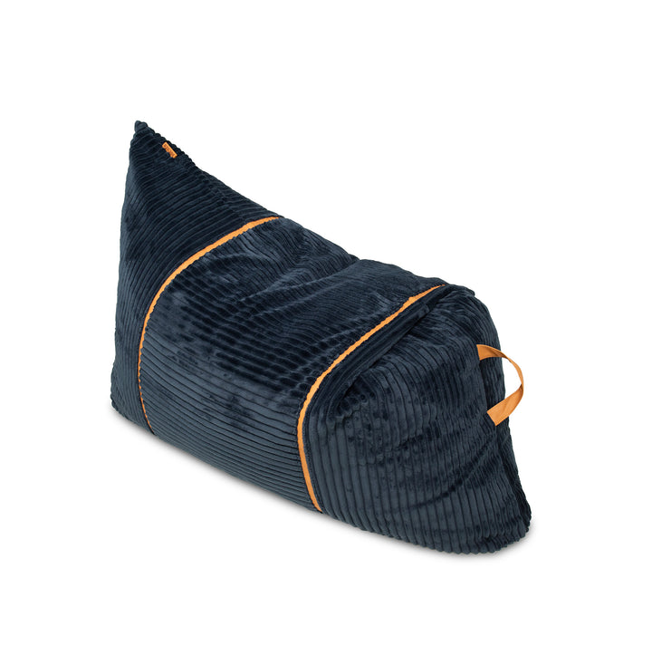A dark navy blue corduroy bean bag chair with orange contrast piping and a matching orange handle, shown on a clean white background. 