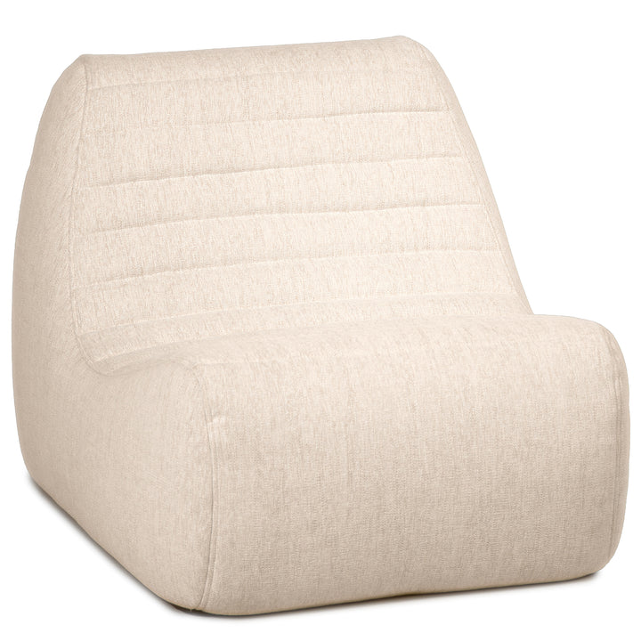 Beige wedge-shaped seat cushion on a white background #color_sunlit-cream-outdoor-performance-linen