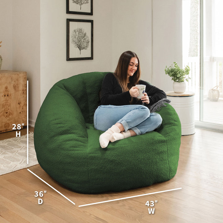 Woman sitting on a green bean bag chair in a room with dimensions displayed 