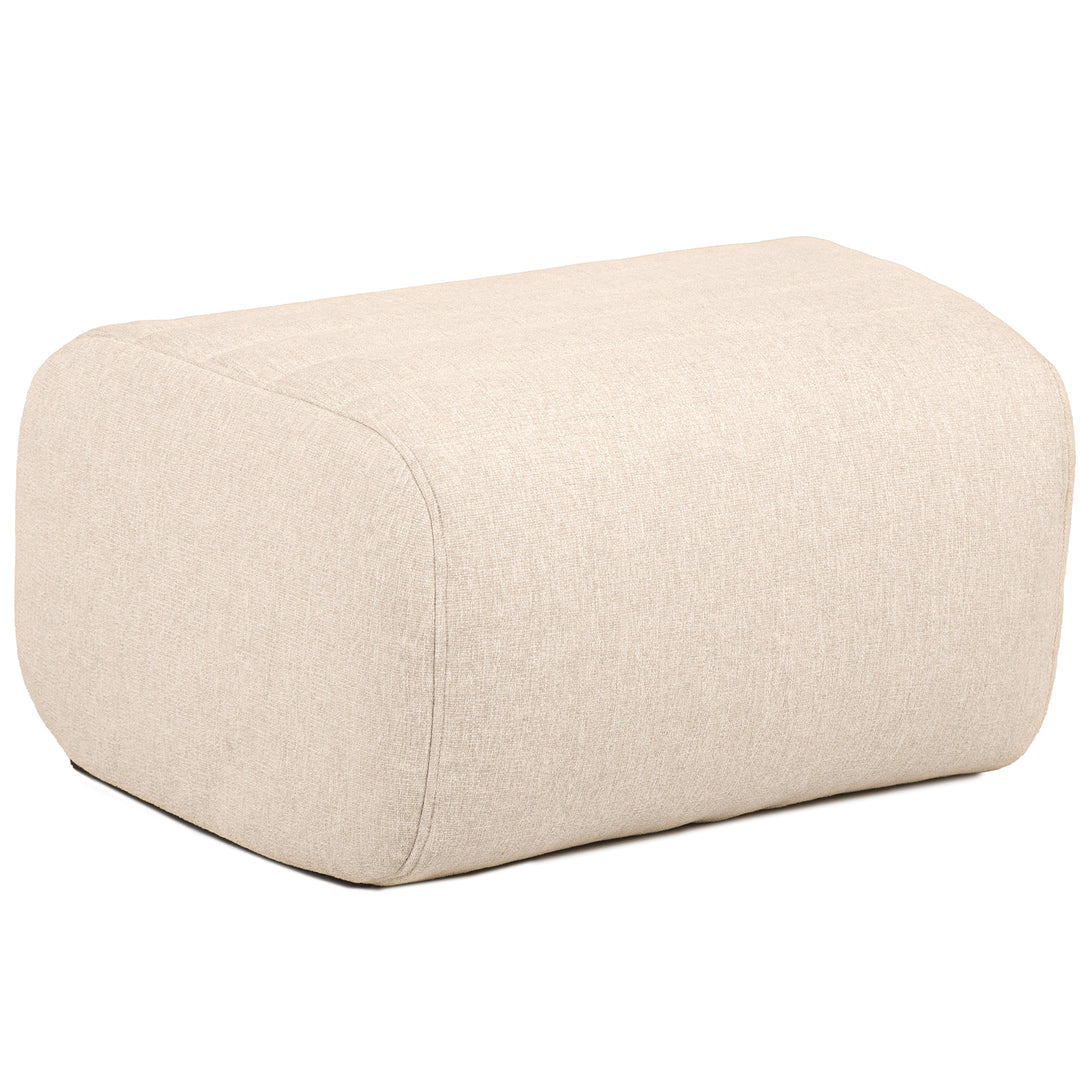 Beige ottoman on a white background #color_sunlit-cream-outdoor-performance-linen