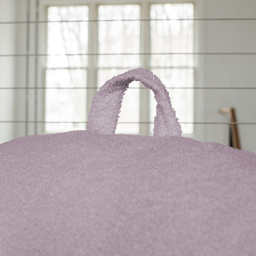 Close-up of a textured purple bag with a blurred background 