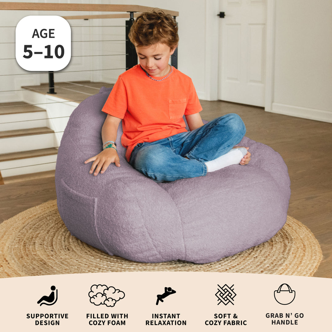 Child sitting on a purple bean bag chair in a home setting with product features displayed below. 