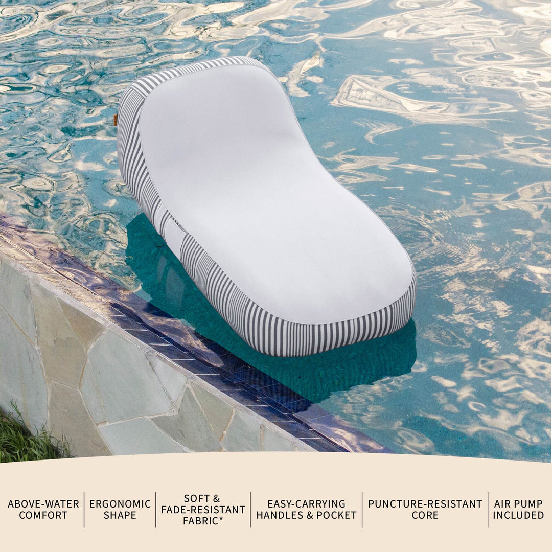 Inflatable lounge chair with striped design on a pool edge #color_shoreline-gray-stripe-olefin