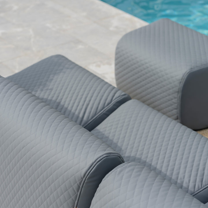 Gray quilted outdoor furniture set by a pool #color_moonlit-gray-outdoor-vegan-leather
