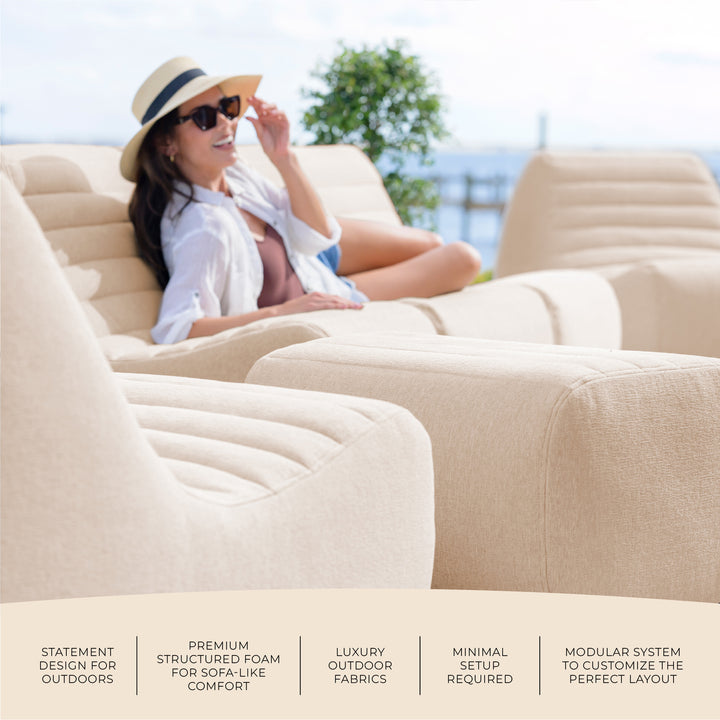 Woman relaxing on an inflatable outdoor sofa with text highlighting features. #color_sunlit-cream-outdoor-performance-linen