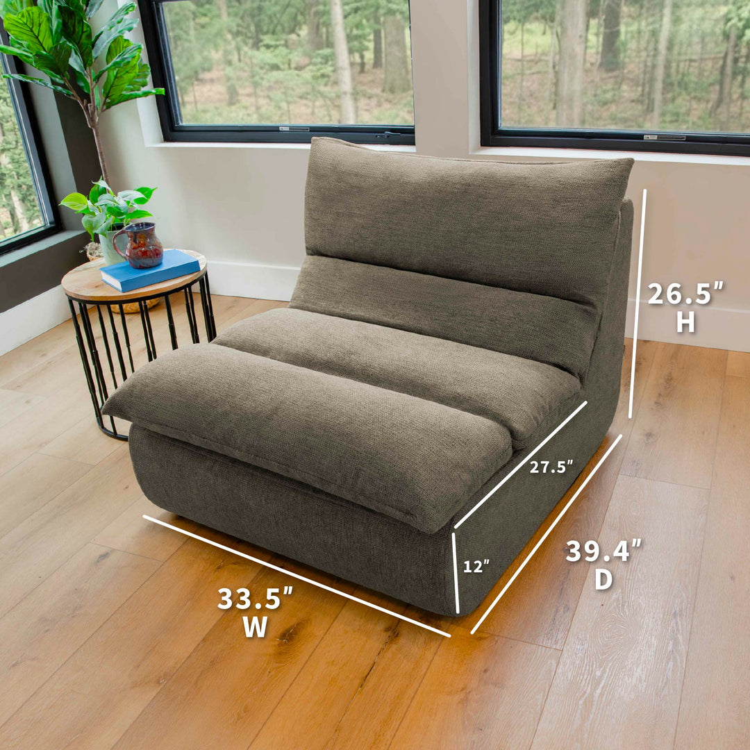 Gray modular chair with dimensions on a wooden floor in a room with windows. 