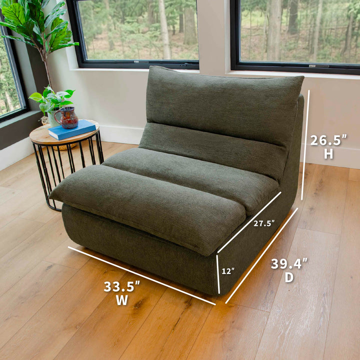 Green modular chair with dimensions on a wooden floor in a room with windows. 