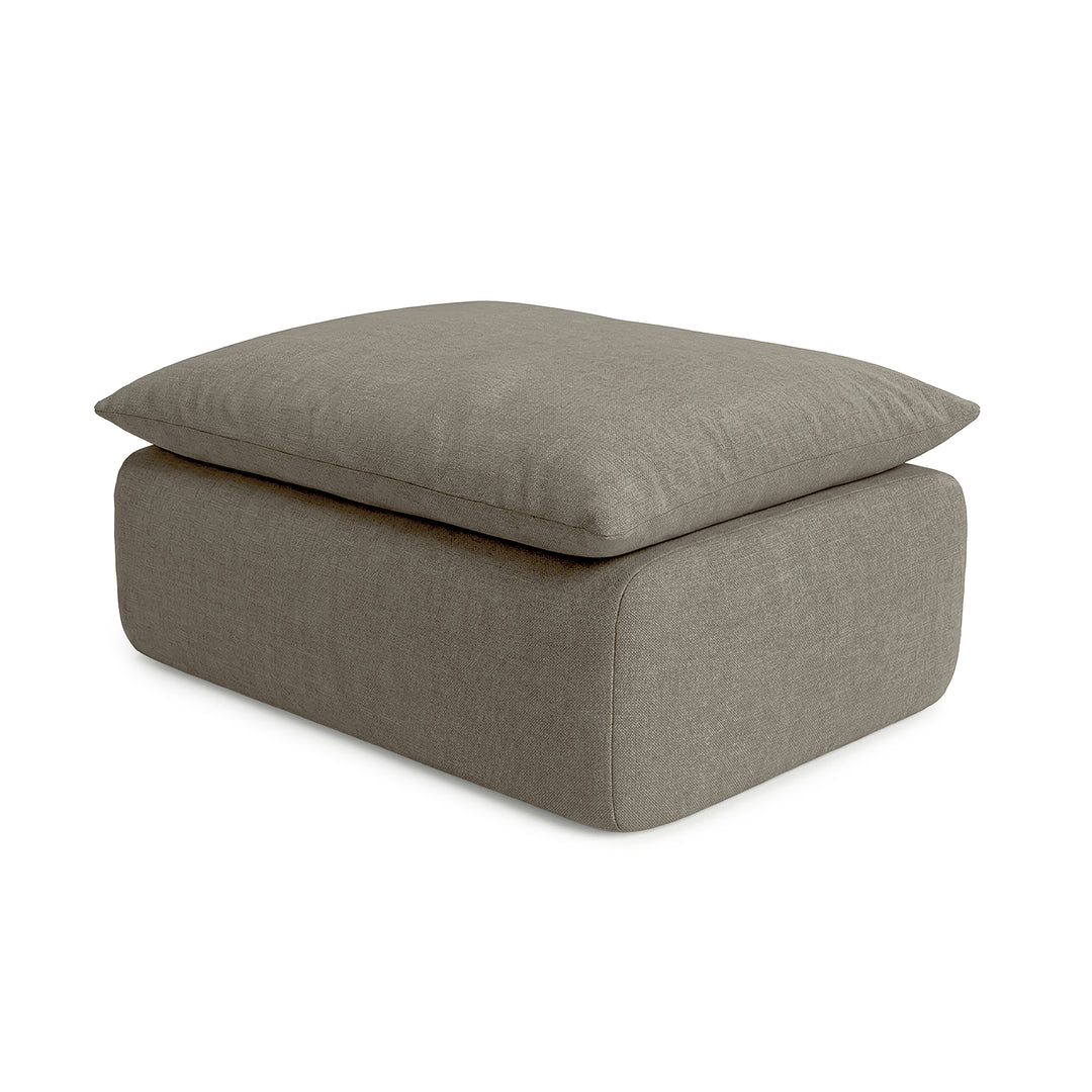 Gray ottoman with cushion on a white background 