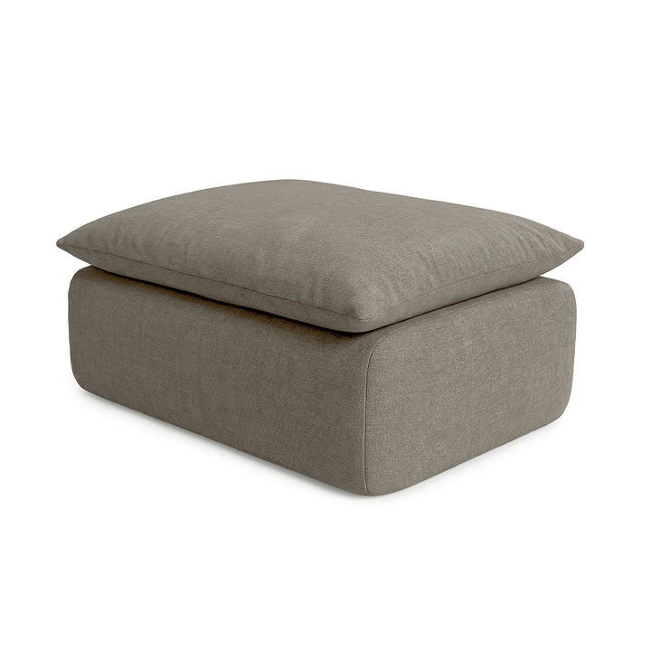 Gray ottoman with cushion on a white background 