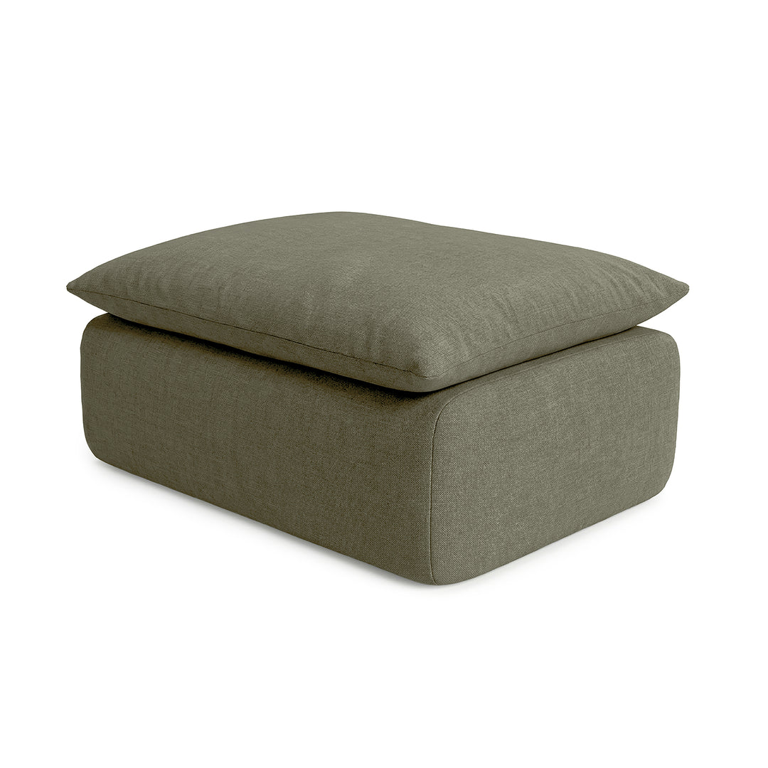Green upholstered ottoman on a white background 