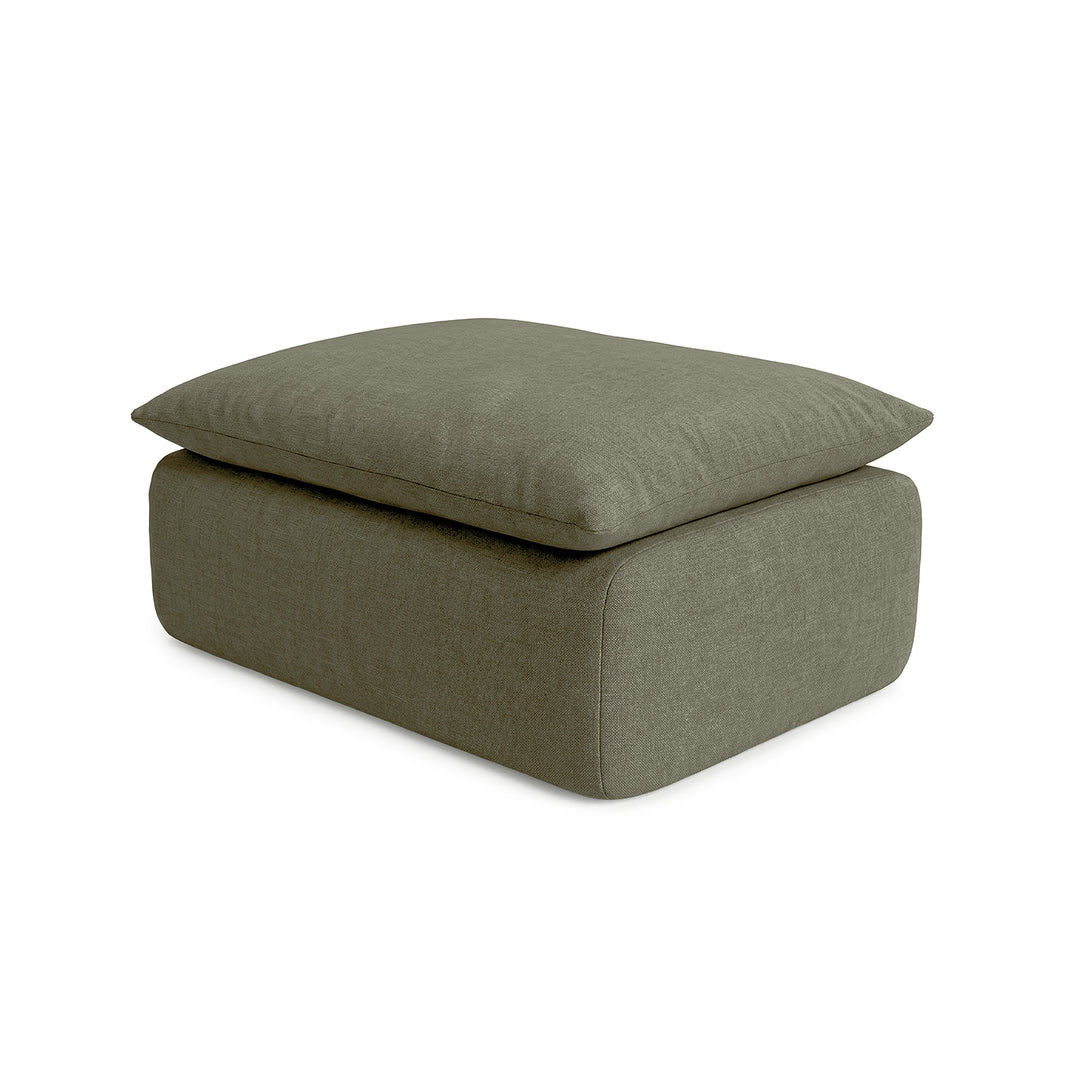 Green ottoman with cushion on a white background 