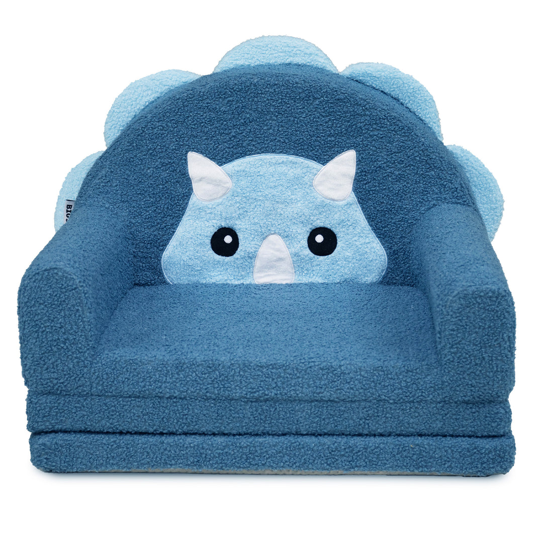 A blue plush children's armchair with a dinosaur face design on the front and a scalloped backrest, shown on a plain white background. #style_blue-dinosaur
